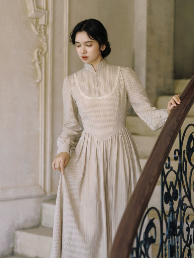 Beige cottagecore long sleeve dress with striped fabric, fitted bodice and gathered full-length skirt