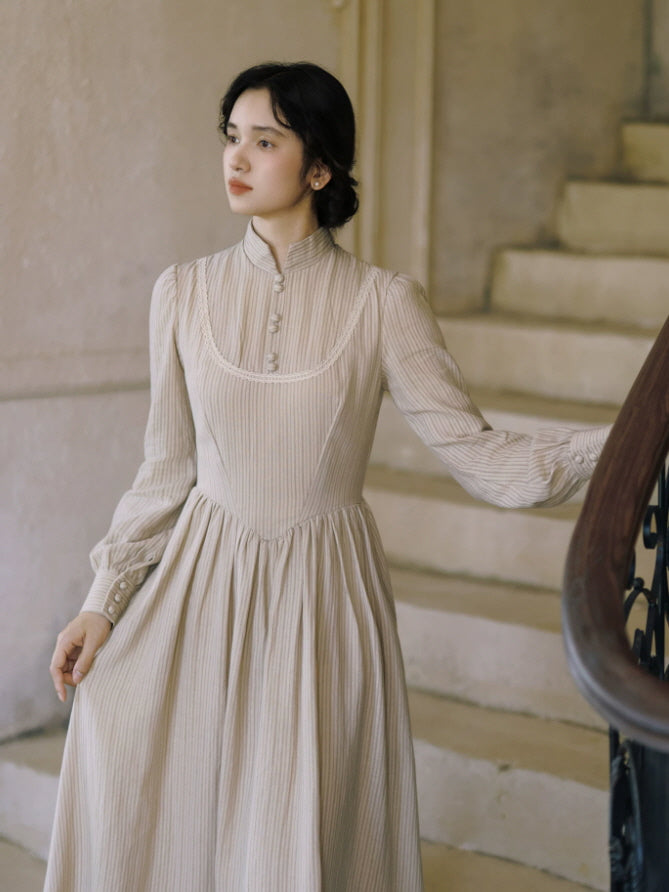 Romantic vintage maxi dress in soft beige stripes with high collar, lace trim and puffed long sleeves