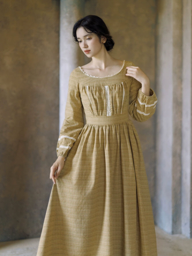 Women’s mustard vintage dress with check pattern, lace-trimmed bodice and long gathered sleeves