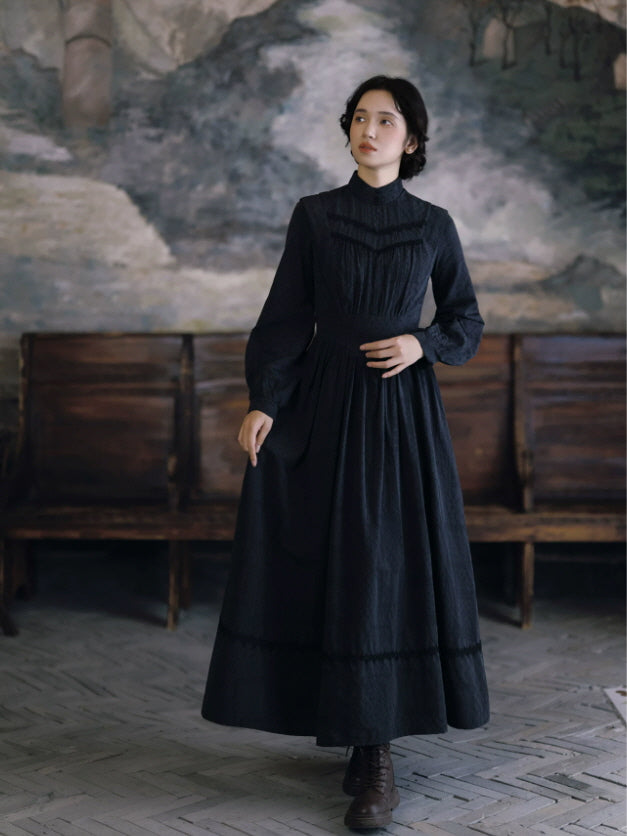 Romantic black cottagecore dress with gathered bodice, high collar and vintage maxi silhouette