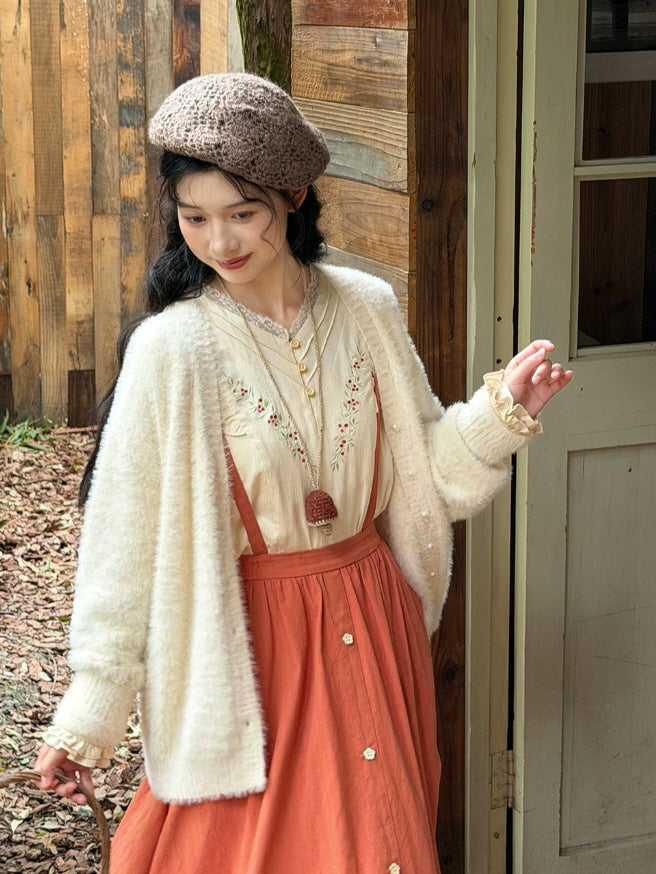 Romantic cottagecore blouse and rust maxi skirt styled with a knit beret and soft cardigan