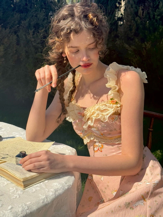 Young woman in a vintage-inspired floral lace dress, thoughtfully holding a pen with a whimsical, dreamlike expression while writing in a notebook.