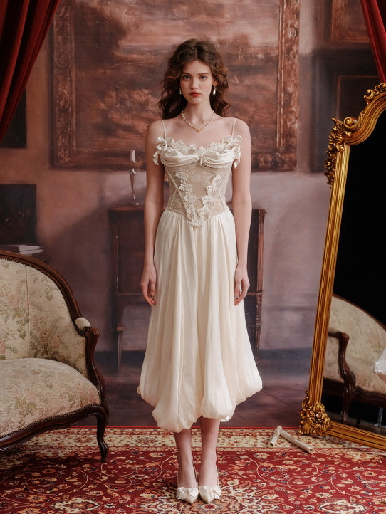 Romantic cream balloon skirt styled with floral lace corset top, photographed in vintage interior with antique furniture – elegant fairytale aesthetic women's fashion