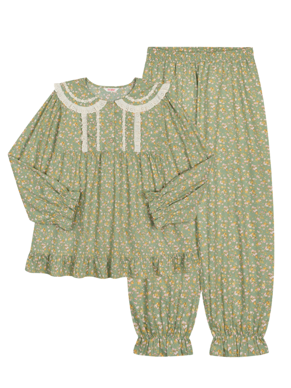A flat lay of a green floral loungewear set with lace accents and elastic cuffs, showcasing its soft, vintage aesthetic and charming fairytale feel.