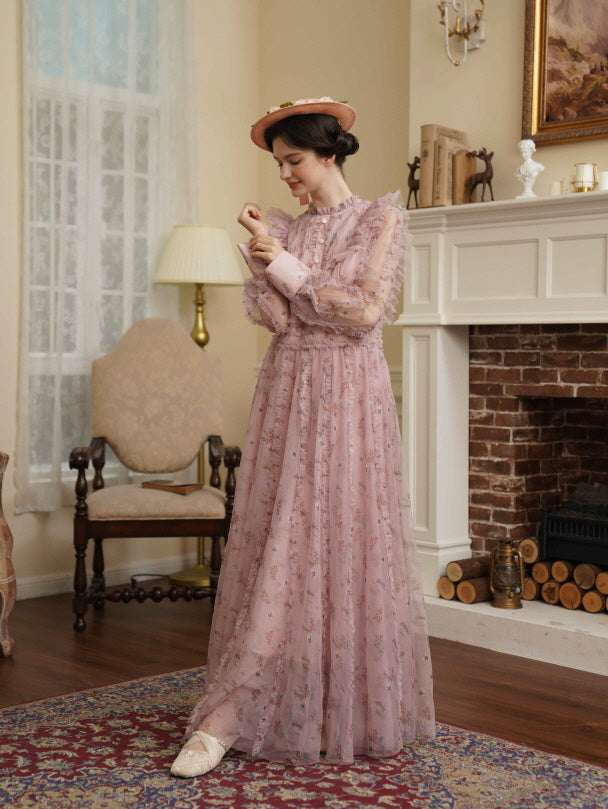 Wearing a sheer pink floral ruffle dress, the model smiles softly in a vintage room, creating a warm and elegant princesscore mood.