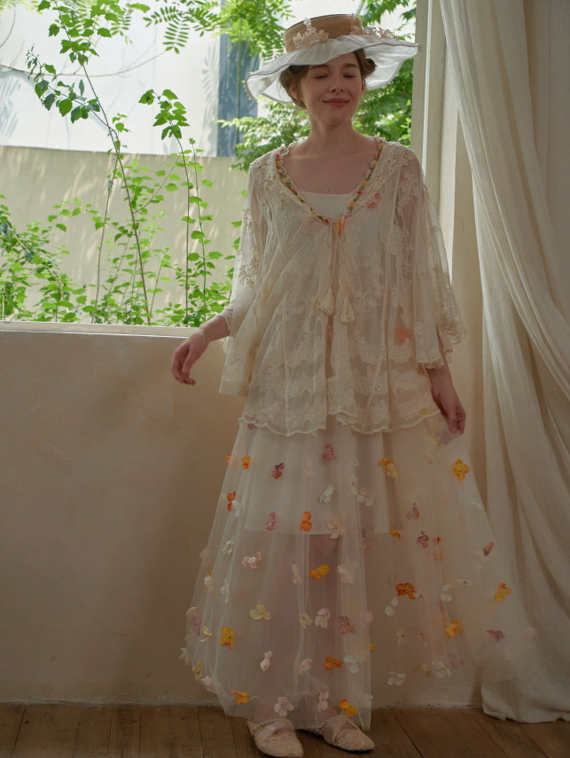 Smiling softly, the model twirls in a butterfly-embroidered mesh dress and flowing lace top, glowing in vintage springtime aesthetic.