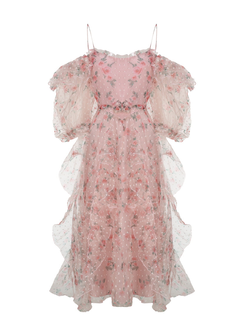 A fairytale-inspired pink mesh dress with ruffled floral layers, puff sleeves, and dotted texture displayed flat to show elegant princesscore design.
