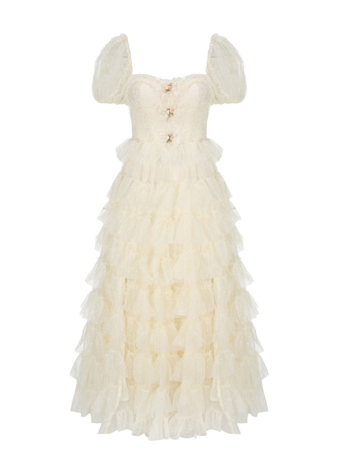 Flat lay of an ivory tiered dress with puff sleeves and ribbon floral accents, perfect for princesscore and vintage-inspired romantic styling.
