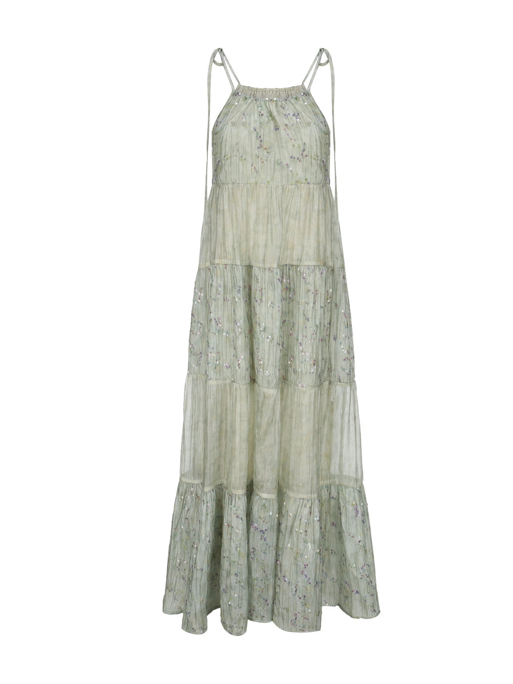 Flat lay of a pastel green tiered halter dress with subtle floral shimmer, ideal for dreamy cottagecore and fairytale summer looks.